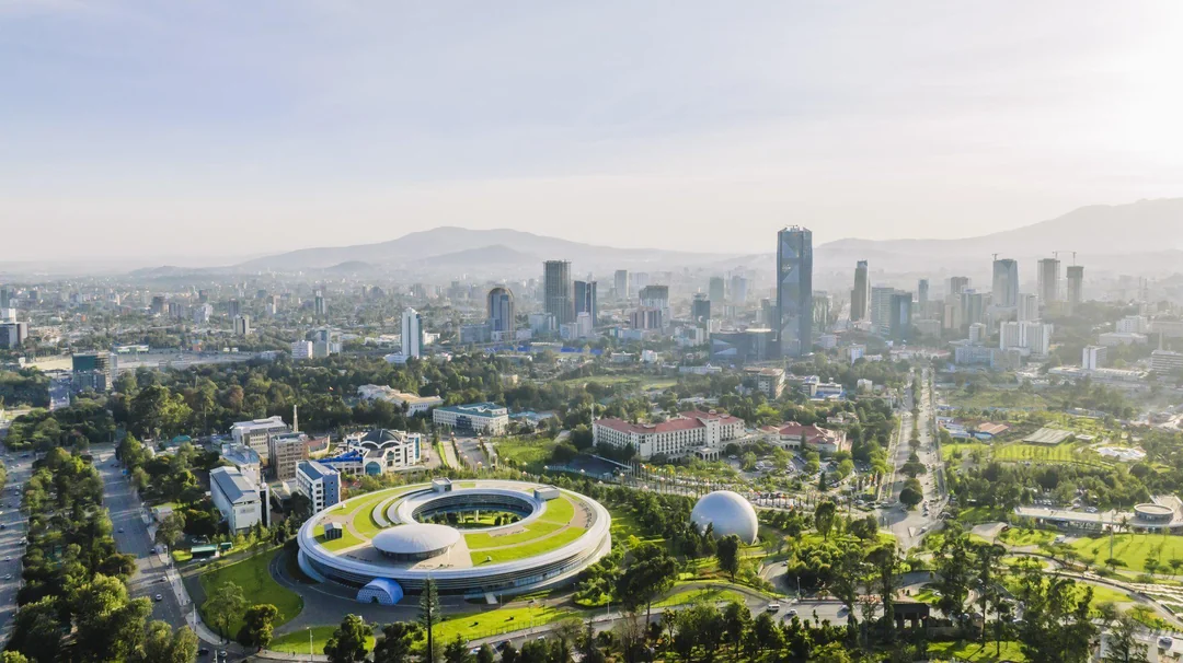 Aerial view of Addis Ababa with the green-roofed Science Museum and the city skyline